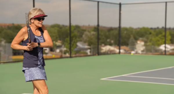 Woman playing tennis outdoors