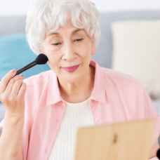 Woman applying makeup