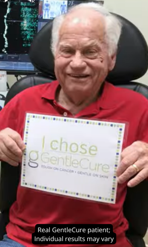 Man holding sign that reads, "I Chose GentleCure"